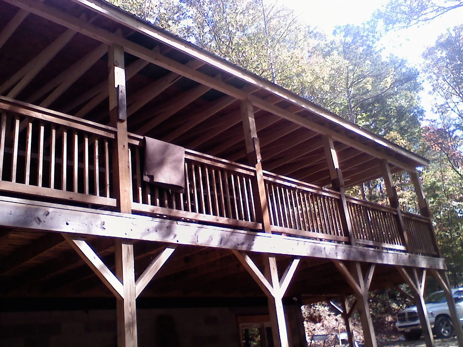 Timber framing under a new elevated porch and deck — Roof Leak Repair in Parkville by Roofing Brothers